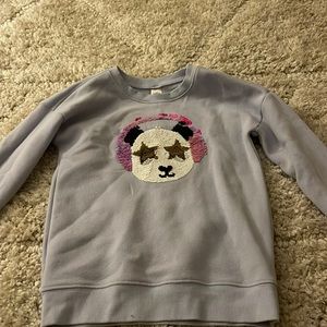 Sweater with changing glitter sequins